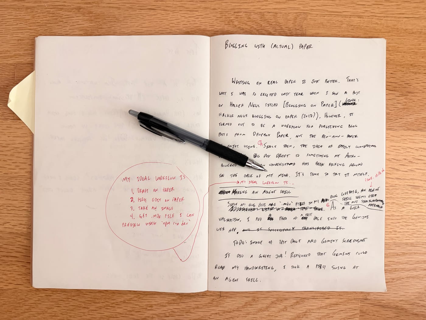 My notebook, open to the draft of this blog post, with a pen on top.